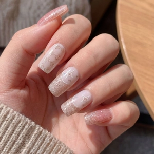 Sparkly butterfly nail stickers with glitter heart and star designs in soft pink