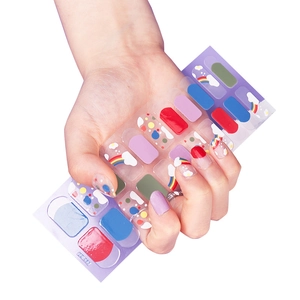 Rainbow nail art stickers featuring cloud and colorful polka dot designs for summer manicures