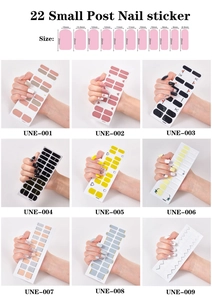 Detailed sheet of self-adhesive nail stickers with varied French and glitter patterns