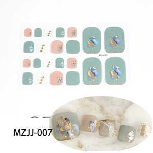Close-up of 5D toe nail decals with gold foil and Morandi green marble glitter patterns