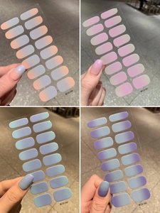 Detail view of four gradient nail sticker sets showing color transitions and real application