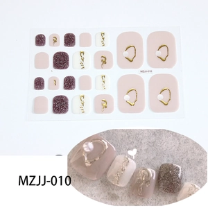 Detail view of 5D glitter toe nail stickers in purple and pink with gold relief