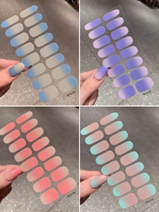 Detail showing four sets of ombre nail stickers in blue, purple, red, and pink colors