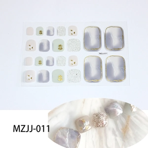 Detail of 5D toe nail stickers featuring marble textures, gold foil and mint green hues