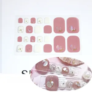 Detail of MZJJ-017 pink toe nail stickers with faux pearls and golden foil accents