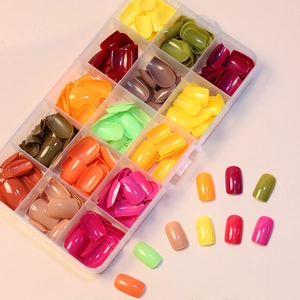 Short square solid color false nails set in a 15-grid transparent organizer box