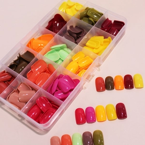 Set of 360 short solid color glossy false nails in 15 vibrant hues with storage box