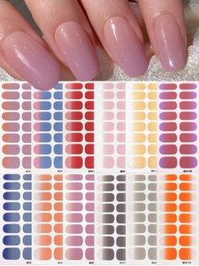Macro detail of twelve multi-color gradient nail stickers for manicure art sets