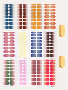 Flat lay set of gradient nail stickers in various colors with mini nail files