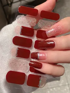 Detail of adhesive nail stickers in deep wine red and silver glitter with sequins