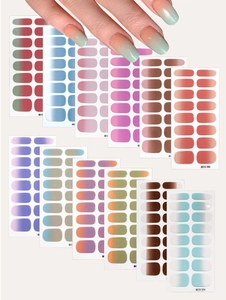 Close-up of assorted gradient nail stickers with model hand showing the applied effect