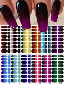 Macro detail of long gradient nail stickers in 12 color sets with ombré finish