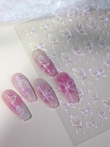 3D relief nail art stickers with white butterflies and pearls on pink gradient nails