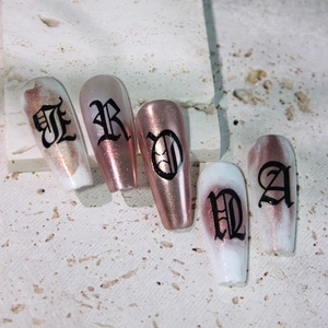 Gothic letter press-on nails in long coffin shape with rose gold metallic glitter