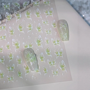 3D butterfly nail stickers in white and green with embossed textures for nail art