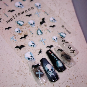 Halloween matte 3D nail art stickers with skulls and bats shown on finished nails
