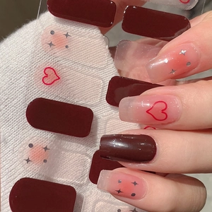 Short square press-on nails in burgundy and pink with heart and star glitter design