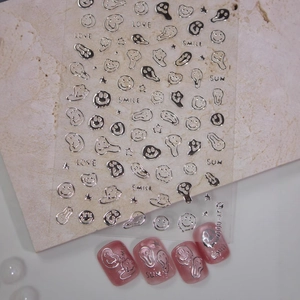 Silver metallic melting smiley face nail stickers with Y2K stars for DIY nail art