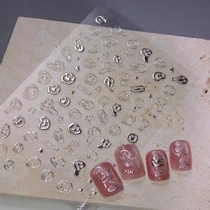 3D metallic silver nail art stickers with melting smileys and stars on pink nails
