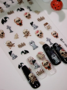 Detailed Halloween nail decals featuring 3D matte skulls and cross designs for spooky manicures
