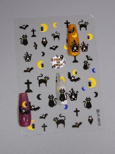 Detailed Halloween nail decals featuring black cats, bats, and moons with matte finish