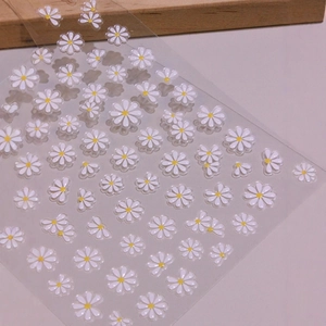 5D embossed white daisy nail art stickers with yellow centers for DIY manicure designs