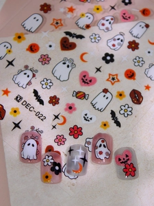 Halloween nail art decals featuring cute ghost, pumpkin, and bat designs for festive nails
