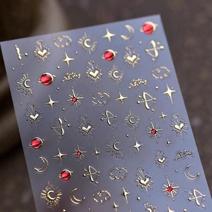 3D gold embossed nail stickers with red celestial sun moon and star designs