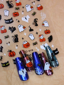 Macro shot of Halloween nail decals EC-019 featuring pumpkin and ghost patterns