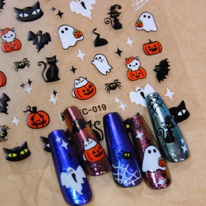 Halloween nail stickers with pumpkins and ghosts patterns on glitter manicures