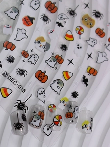 Detailed view of Halloween nail art stickers with cute pumpkin and cat patterns