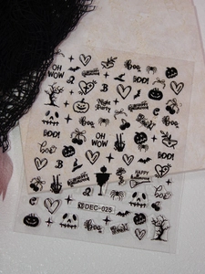 Macro shot of Halloween nail stickers DEC-025 featuring black pumpkins and bats
