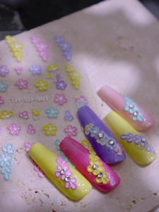 Detailed 5D embossed nail stickers showing floral patterns and 3D textured DIY manicure