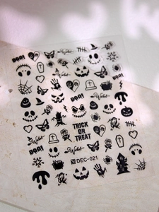 Detail of Halloween nail decals featuring Jack Skellington, spider webs and bats patterns