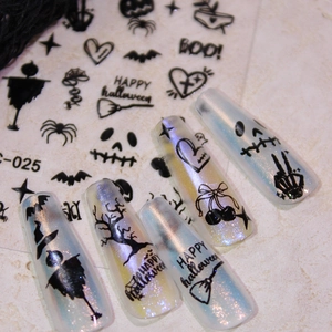 Halloween nail stickers with black bat and ghost designs on aurora shimmer fake nails