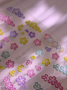 Macro detail of 5D embossed floral nail art stickers TH-5D-001 with textured petals