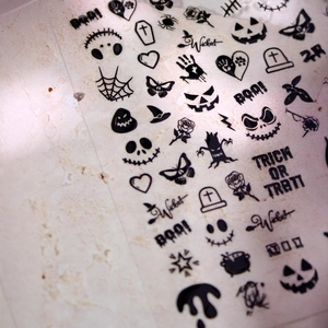 Halloween 3D nail decals with black embossed pumpkins, skulls and spooky spider web patterns