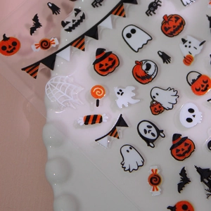 Halloween nail art stickers with pumpkin, ghost, and bat patterns on white background