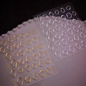 3D metallic circle nail art stickers in gold and silver with relief texture