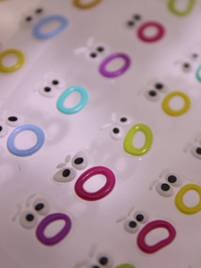 Macro shot of 3D embossed colorful lip-shaped self-adhesive nail art stickers