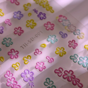 Stereo 5D embossed nail art stickers with colorful 5-petal flower designs on transparent film