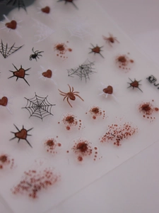 Detailed 3D Halloween nail stickers with blood splashes, spider webs, and thorny hearts