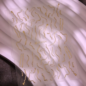 3D metallic gold wave line nail art stickers with minimalist liquid metal style design