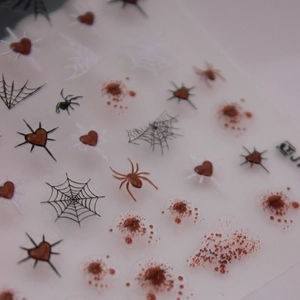 3D Halloween nail stickers featuring gothic spiders, webs, and blood splash patterns