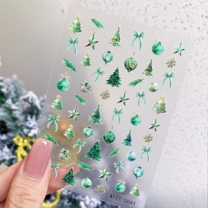 Laser gradient Christmas nail art stickers with 3D aurora effect and green tree patterns