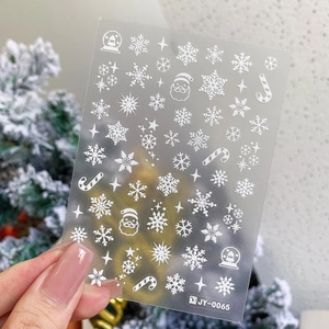 3D white embossed Christmas nail decals with snowflakes and Santa Claus patterns