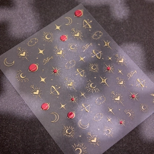 3D gold foil nail art stickers featuring moon and star patterns on dark background