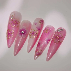Pink gradient cherry blossom stiletto fake nails with gold foil and rhinestones