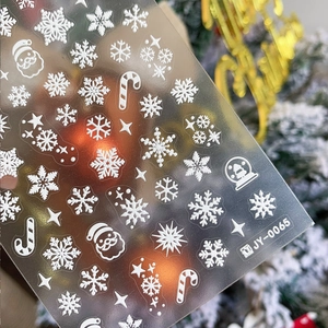 White matte 3D embossed Christmas nail stickers with snowflakes and festive patterns