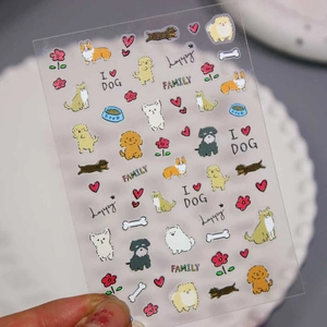 3D embossed 5D nail art stickers featuring cute cartoon dogs and cats on a hand-held sheet
